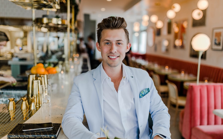 Smiling business owner at the counter of his shop